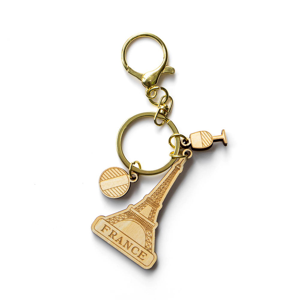 france keychain, eiffel tower souvenir, wooden keyring, paris travel gift, french tourist keychain, custom wooden souvenir, laser cut keychain, wholesale gift supplier, france b2b souvenir, eco wood keychain