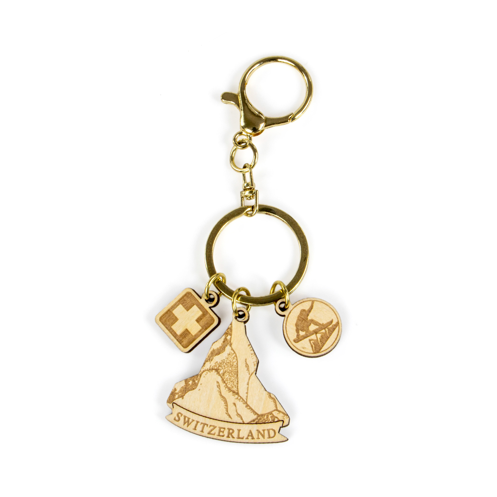 switzerland wooden keychain, swiss alps souvenir, mountain keychain, skiing gift keyring, swiss cross charm, laser cut wood keychain, gold hardware keychain, switzerland b2b gift, custom tourism product