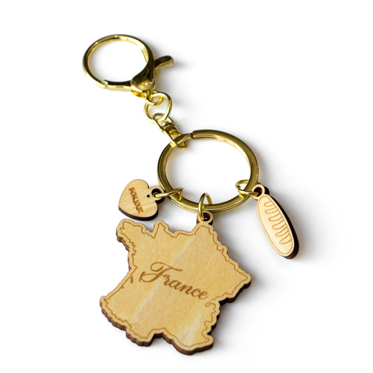 france keychain, france map souvenir, wooden travel keyring, french souvenir gift, custom wood keychain, laser cut france keychain, eco friendly keyring, baguette charm souvenir, bonjour keychain, wholesale souvenir supplier