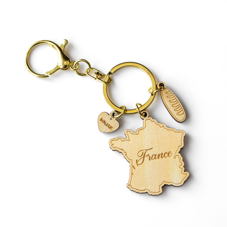 france keychain, france map souvenir, wooden travel keyring, french souvenir gift, custom wood keychain, laser cut france keychain, eco friendly keyring, baguette charm souvenir, bonjour keychain, wholesale souvenir supplier